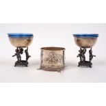 A pair of Italian silver pedestal salts, the plain rounded bowls supported by a ring of three