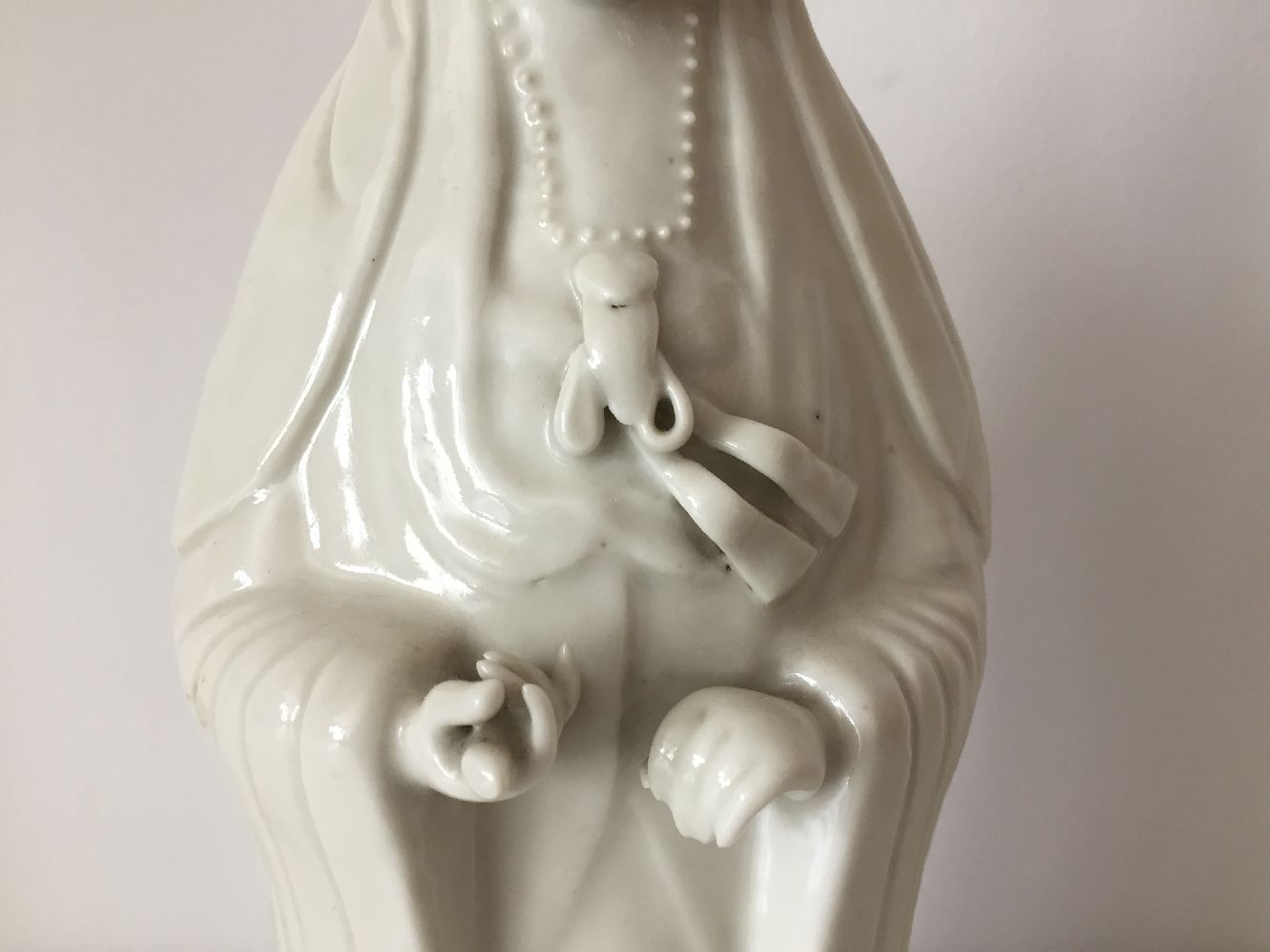 A Chinese Dehua porcelain figure of Guanyin, 19th century, modelled standing with long flowing - Image 10 of 11