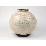 A large rotund Korean pottery moon vase, 20th century or earlier, with double-crackle glaze, hand-