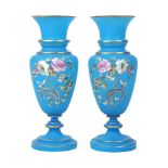 A pair of blue opaline glass vases, second half 20th century, each decorated with floral sprays,