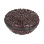 A Chinese tixi lacquer circular box and cover, 19th century, carved through layers of red and
