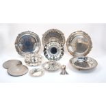 A group of silver plated bowls, trays and dishes including a circular flowerhead-design German