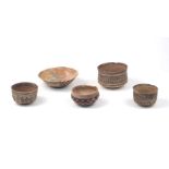 A group of modern Neolithic style bowls, of traditional form in terracotta, with hand-painted slip