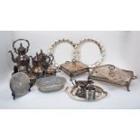 A quantity of silver plate, including: various pierced twin-handled mounts for serving dishes (