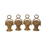 Four brass door stops, 20th century, cast as baskets of flowers, 32cm high (4)Please refer to