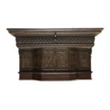 A Victorian Jacobean style oak fire surround, incorporating four 16th century panels from