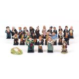 A collection of twenty four Royal Doulton Charles Dickens character figures, 20th century, average