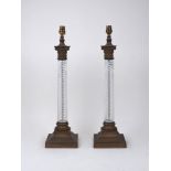 A pair of moulded glass columnar table lamps, late 20th century, each with Corinthian capital and