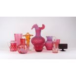 A group of cranberry glass, 20th century, to include a large bulbous textured vase with handkerchief