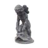 A lead model of a cherub riding a dolphin, early 20th century, on an integral circular base, 42cm