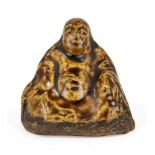 A Japanese glazed composite Budai netsuke, Meiji period, seated buddha with prayer beads in hand,