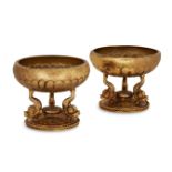 A pair of Greek silver-gilt salts, first half 20th century, each with dolphin supports, stamped in