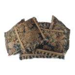 A group of seven tapestry cushions, 17th/18th century, a mixed collection of fragments made into