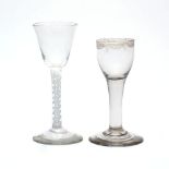 Two wine glasses, early 19th century, comprising an English wine glass, the bell shaped bowl on a