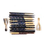 Eight pairs of enamelled bone chopsticks, designed with varicoloured floral enamelled stems to