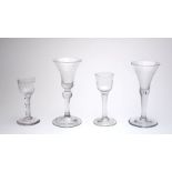 A group of wine glasses, 18th century, to include one with plain bell bowl and baluster stem, 18cm