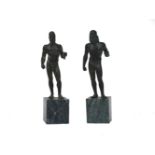 A pair of bronze models of Classical men by studio Romanelli , 20th century, after the Antique, on