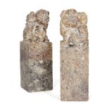 Two Chinese soapstone seals, early 20th century, carved as foo dogs perched atop rectangular