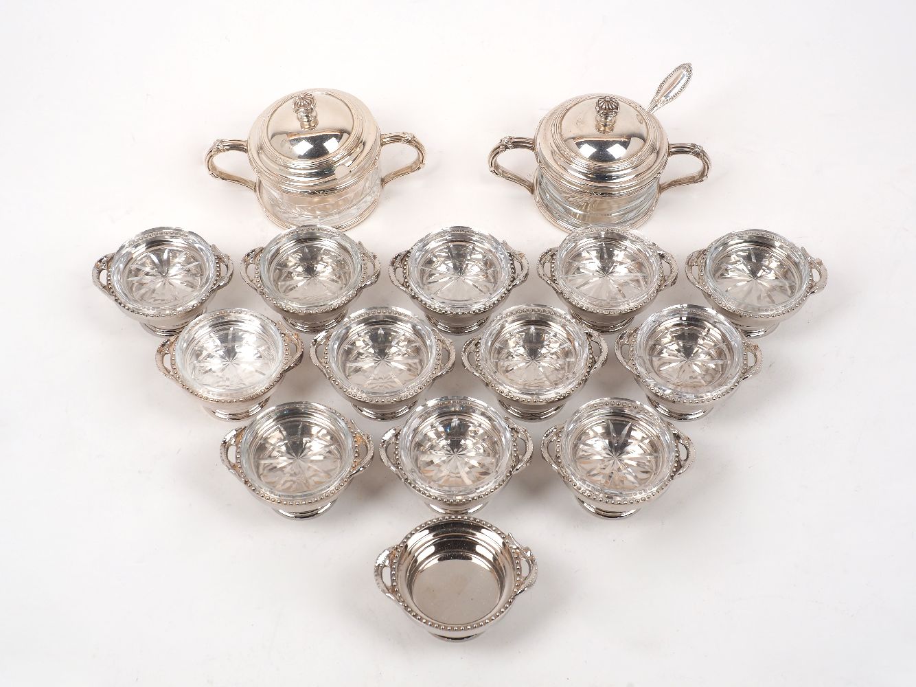 A matched pair of Buccellati silver mounted glass sugar/jam bowls, signed Gianmaria Buccellati,
