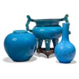 A Chinese porcelain monochrome turquoise glazed tripod censer, 18th century, of bombe form raised on