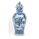 A Chinese porcelain vase and cover, mid-19th century, with blue and white hand painted decoration