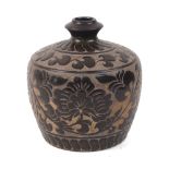 A Chinese sgraffito brown-glazed Cizhou-type jar, 20th century, covered in a rich brown glaze carved
