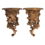A pair of large modern giltwood wall brackets, each with scrolls and foliate motifs, 69cm high (2)