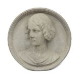 A Victorian composition stone portrait roundel, late 19th century, the female sitter with gaze to