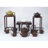 A collection of Yixing pottery, Chinese, of modern manufacture, to include; eight teapots of varying