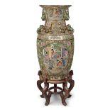 A large Chinese Canton vase, 20th century, decorated with panels of court figures in terrace