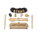 A group of ivory objects of vertu, 19th/early 20th century, to include: a cribbage board with mask