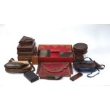 A collection of leather boxes and cases, late 19th/20th century, to include: a red gilt-tooled