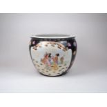 A modern Chinese famille noir porcelain fish bowl, decorated with panels of ladies in a garden