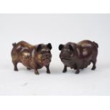 A pair of bronze pigs, 20th century, with red-brown patination, 19cm long (2)Please refer to