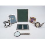 An assortment of silver photo frames, including a late Victorian example, 1895, designed with