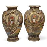 A pair of Satsuma vases, Early 20th Century, each decorated with the gods and applied dragon