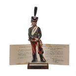 A Van Gerdinge / Sitzendorf porcelain figure of an 1809 Brigadier of the 8th Regiment de Hussards,