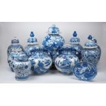 A group of blue and white ceramics, 20th century, comprising: a pair of Delft vases and covers, 43cm