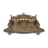 A late Victorian gilt bronze inkstand, late 19th century, with pierced gallery, recessed pen tray