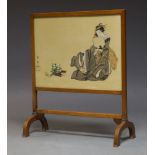 A Japanese fire screen, 20th century, in mahogany frame with panel depicting a bijin holding a