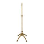 An English brass telescopic standard lamp, by W A S Benson, early 20th century, on four legs with