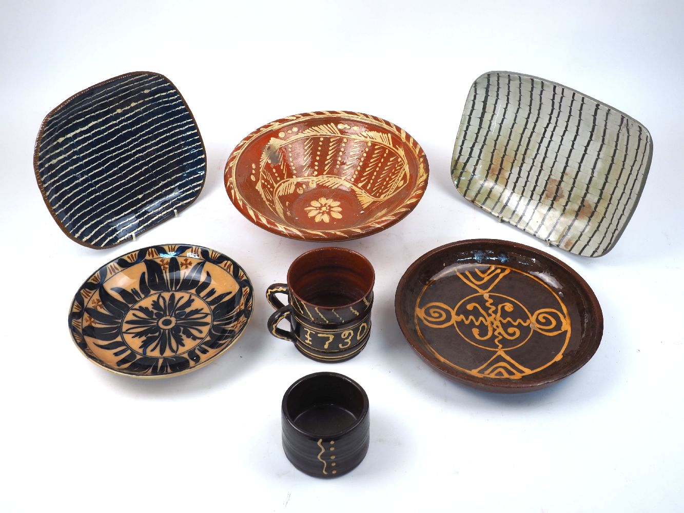 A quantity of slipware and other ceramics, late 19th/20th century, to include; an 18th century-style