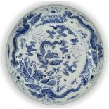 A large Chinese porcelain blue and white 'dragon' dish, late Qing dynasty, painted to the central