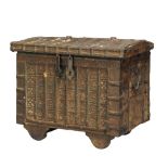 A large Indian iron and wood merchant's coffer, early 20th century, 54cm high x 79cm diam. x 51cm