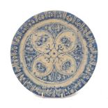 A Safavid-style plate, 20th century, stoneware with painted blue underglaze, 23cm diameter Please