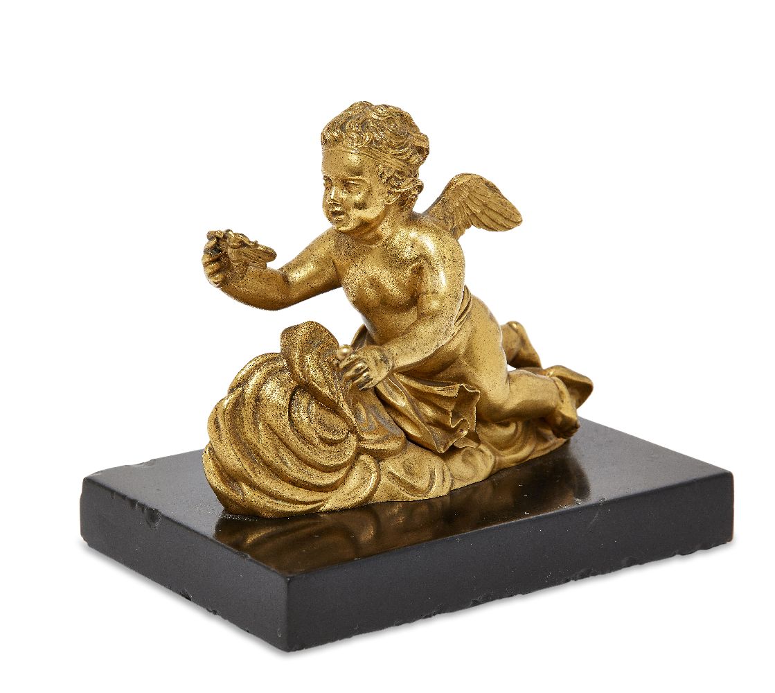 A French gilt-bronze model of a cherub, first half 19th century, depicted floating on a nimbus cloud