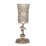 A repousse goblet with figural stem, stamped 13K alongside unidentified marks, possibly German,