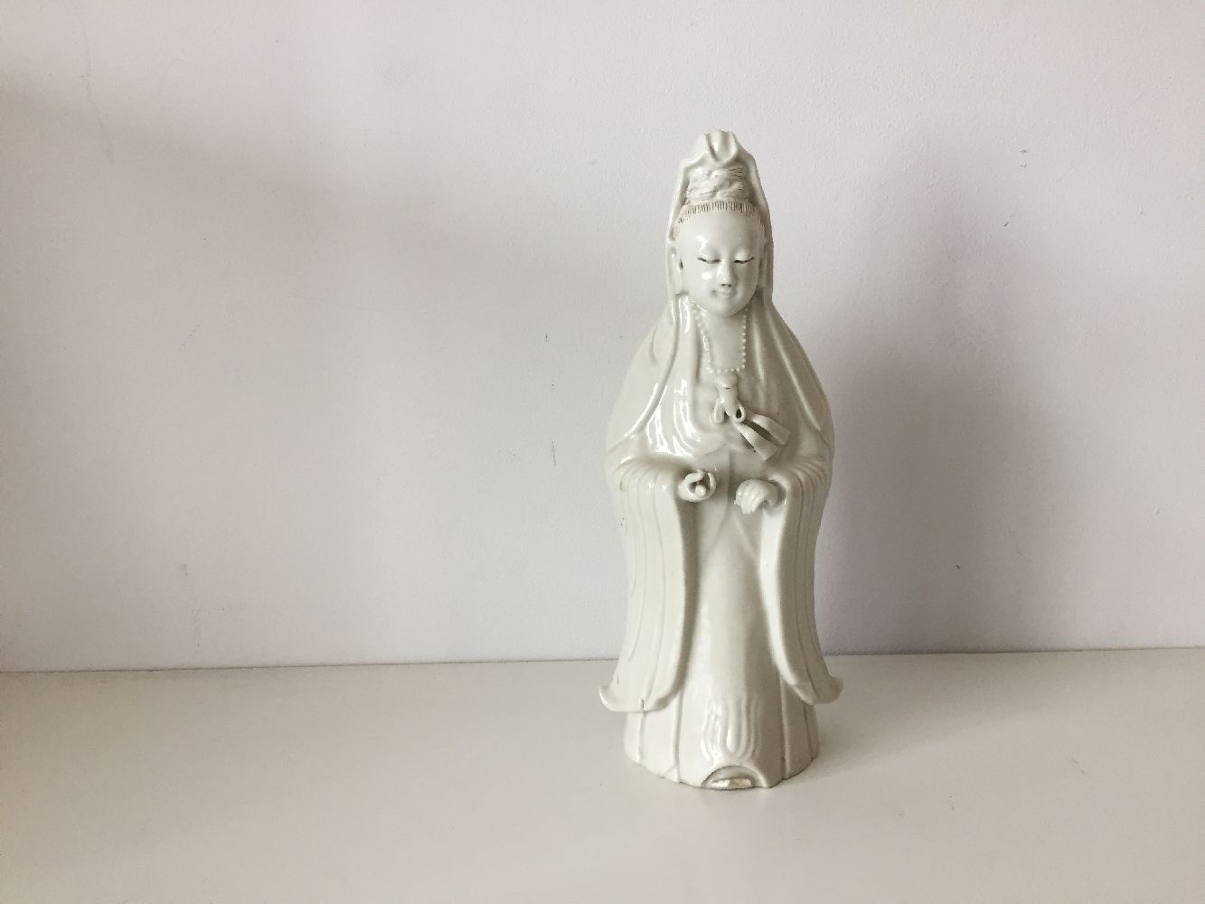 A Chinese Dehua porcelain figure of Guanyin, 19th century, modelled standing with long flowing - Image 4 of 11