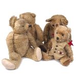 Four teddy bears, mid 20th century, each with swivel joints, three with sewn noses, 67cm long and