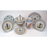 A group of French faience, late 19th/early 20th century, to include a pair of Quimper plates